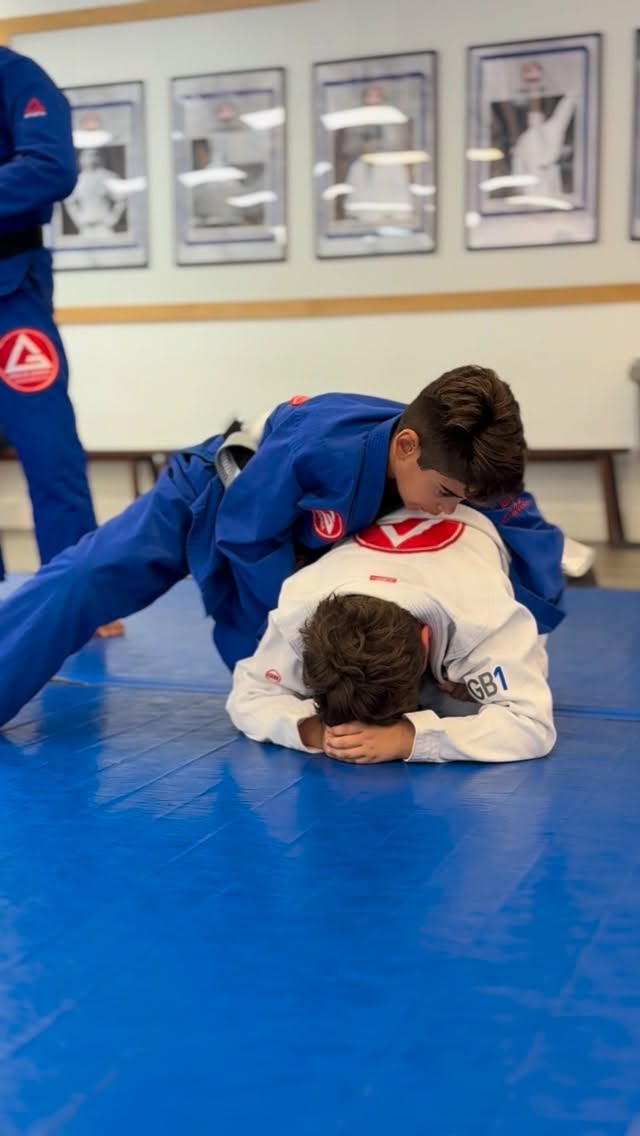 Two kids practicing Jiu-Jitsu in gis at GB Coral Springs